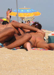 A busty slut at the Cap d'Agde Image 2