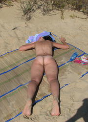 A busty bikini slut undressing on the Tulum Image 1