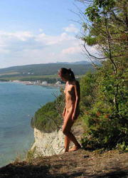 A girl removing her micro bikini at the Mazo Image 8