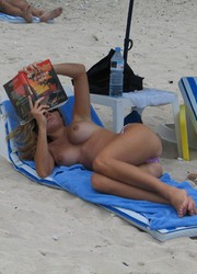 A nude posing at the Matira Image 1