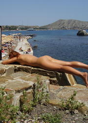 A busty babe getting it at the Santorini Image 9