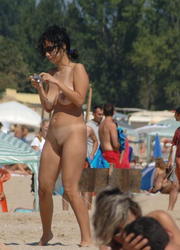 A bikini bitch going topless on the Biarritz Image 7