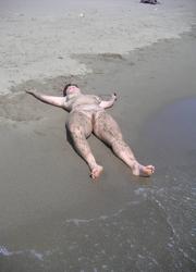 A bikini bitch going topless on the Biarritz Image 8