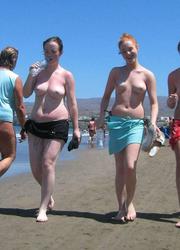 A bikini bitch going topless on the Biarritz Image 12