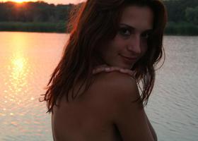 My beloved girlfriend with pretty small boobies likes swimming without any bikini on a lonely beach at sunset. Image 9