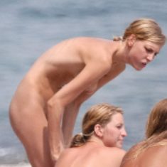 Voyeur photo of nude female on beach