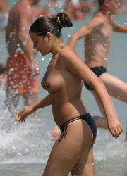 A bikini babe going topless on the Negril Image 5