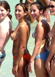 A bikini cutie going topless on the Biarritz Image 8