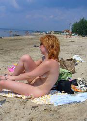 A busty bikini babe undressing on the Baker Image 3
